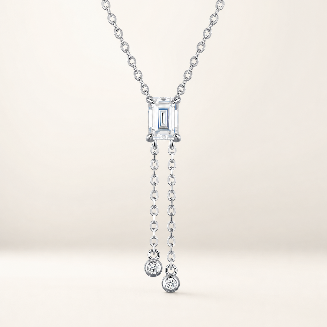 Sillage lariat necklace with emerald-cut centre and twin drops