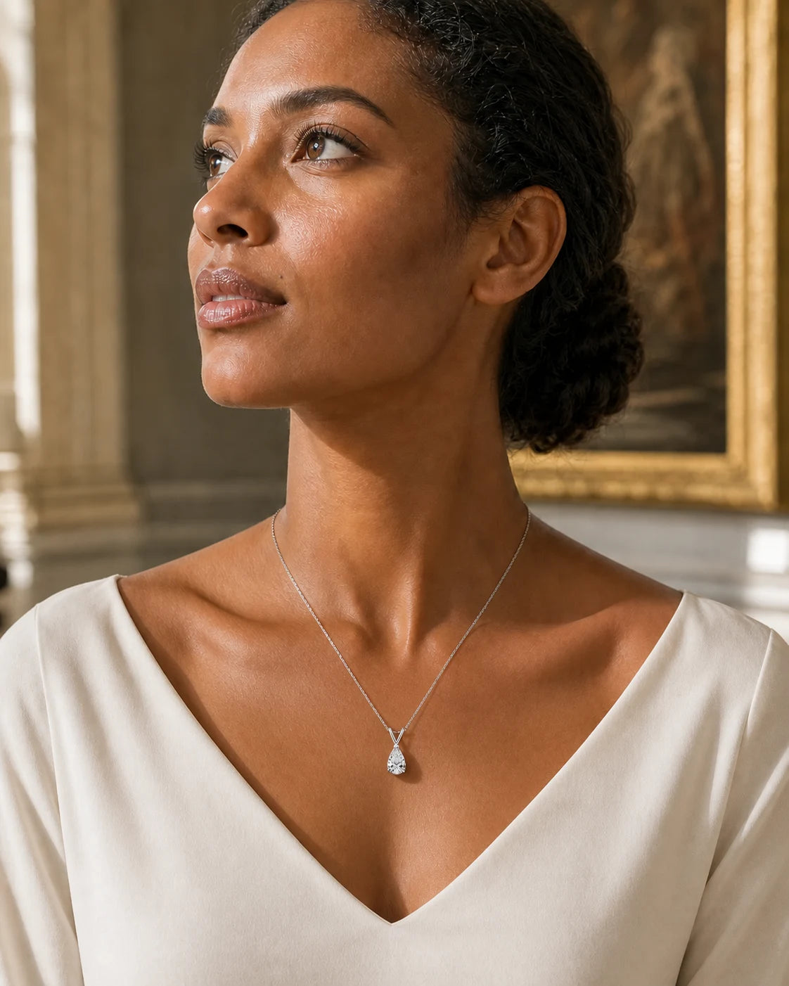 Prisme necklace worn at a natural lower neckline