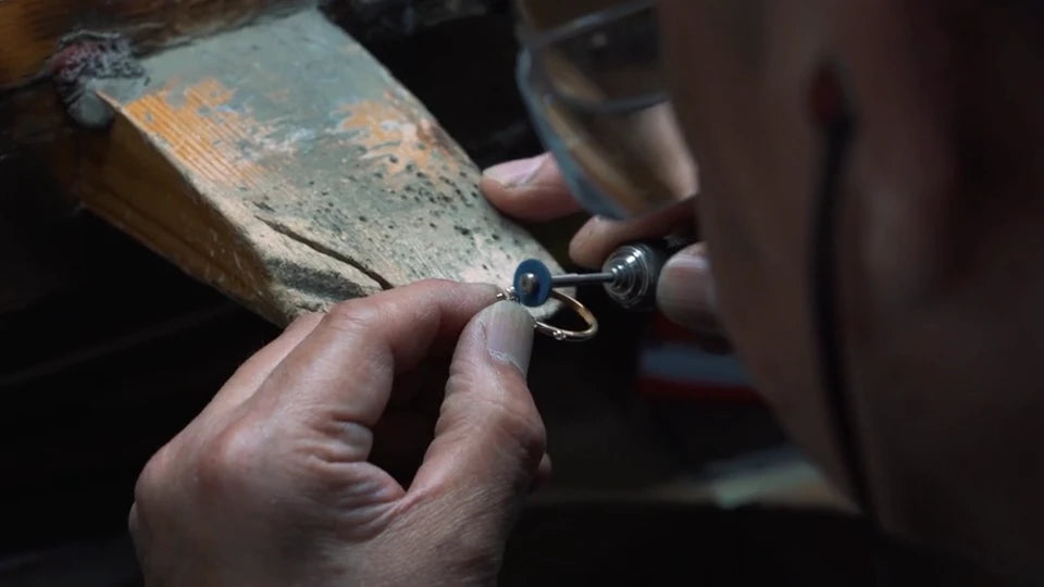 A jeweller setting stones by hand