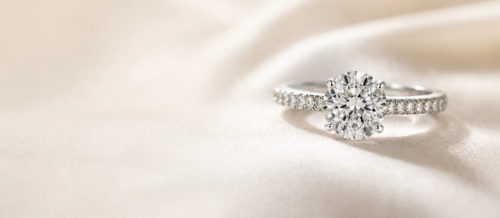 Timeless diamond engagement ring on ivory silk