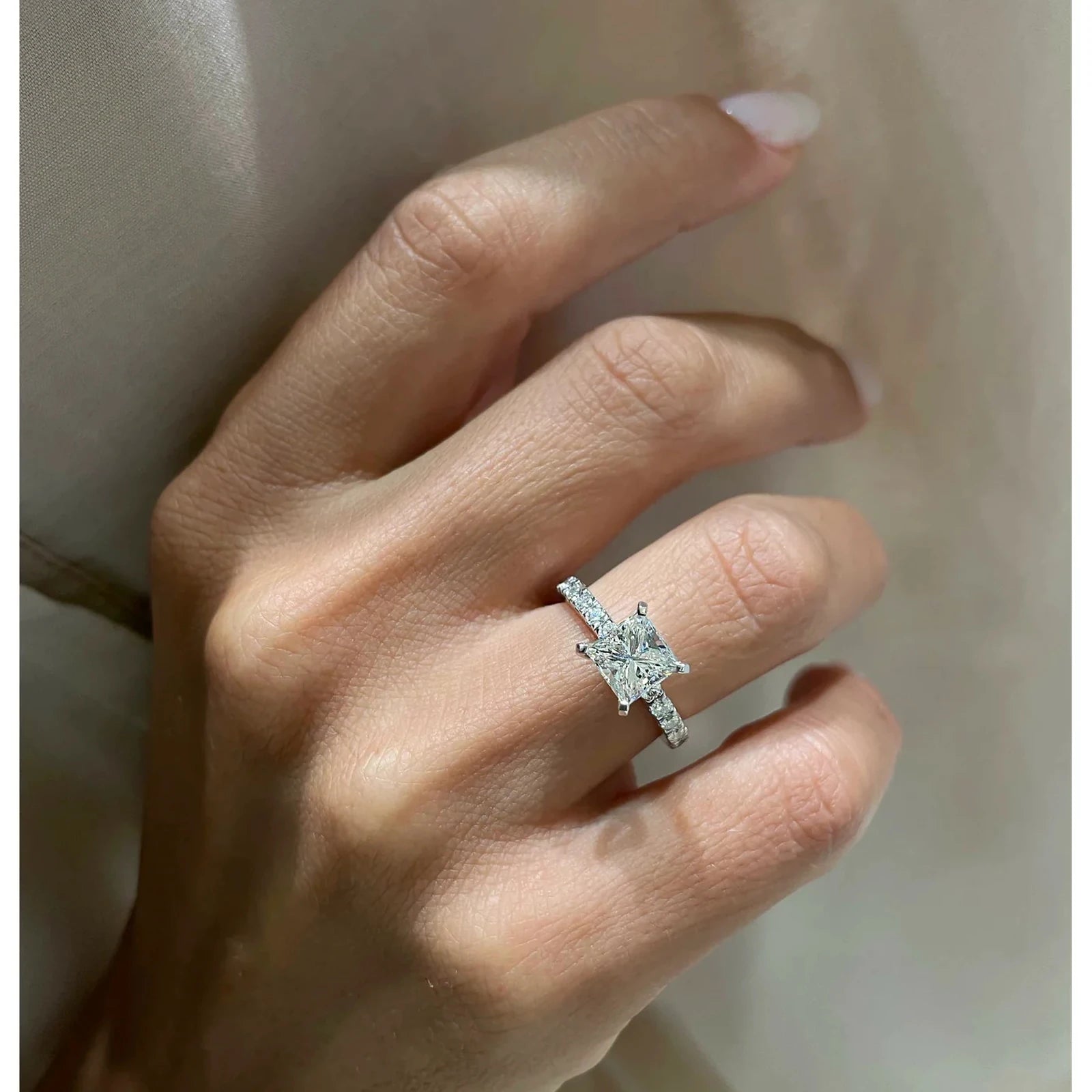 Princesse diamond ring worn on hand
